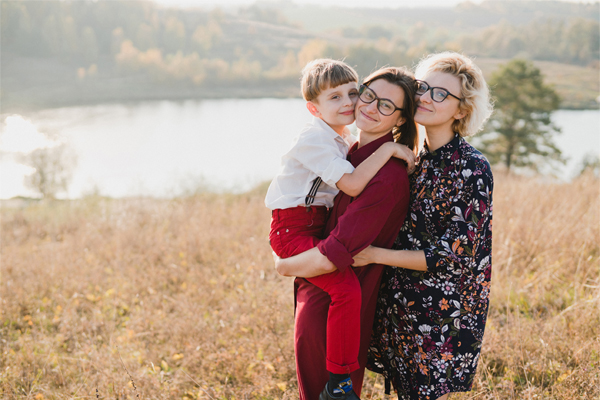 Family with a child walking outdoors.